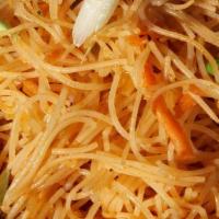 Pancit | Rice Noodles - For Four · thin seasoned rice noodle with carrots, cabbage, celery, annatto, and chicken garnished with...