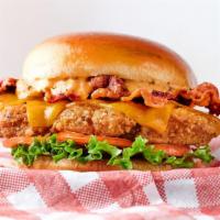 Amazin’ Club · Fried chicken, bacon, cheddar cheese, lettuce, tomato & Cluck Sauce