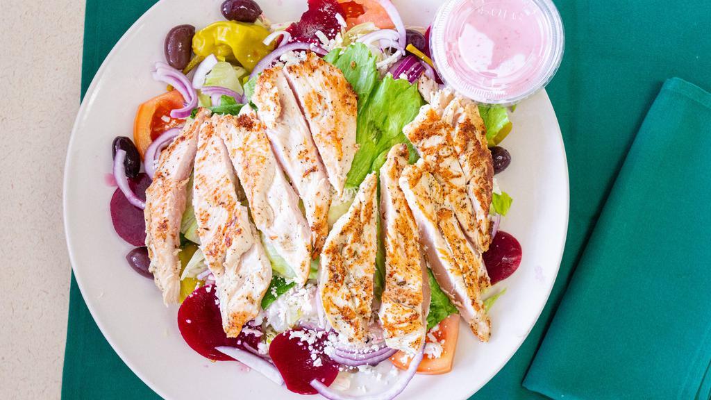Original Greek Salad · Tossed garden, greens, tomatoes, onions, cucumbers, olives, beets, pepperoni and feta cheese topped with our own Greek dressing and served with pita bread.