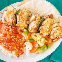 Chicken Kabob · Skewered strips of fresh, marinated chicken breast, with green peppers, onions and pita brea...