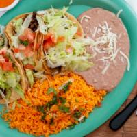 Taco Dinner · El authentico burrito favorite: three tacos, your choice of meat. Served with rice and beans.