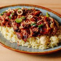 Chicken And Rice: Com Ga · Five spice roasted chicken thighs and fragrant jasmine rice with lemongrass, ginger, and sca...