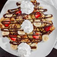 Nutella Fruit Crepes · Filled with bananas, strawberries and hazelnut spread.