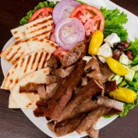 Gyros Plate · Extra portions of gyro meat with pita Bread, tomato, onions, and gyros sauce on the side.