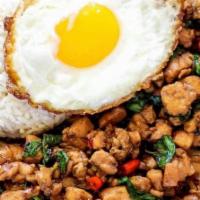 Pad Kra Pow · Ground chicken or pork. thai basil bell pepper onion topped with a fried egg.
