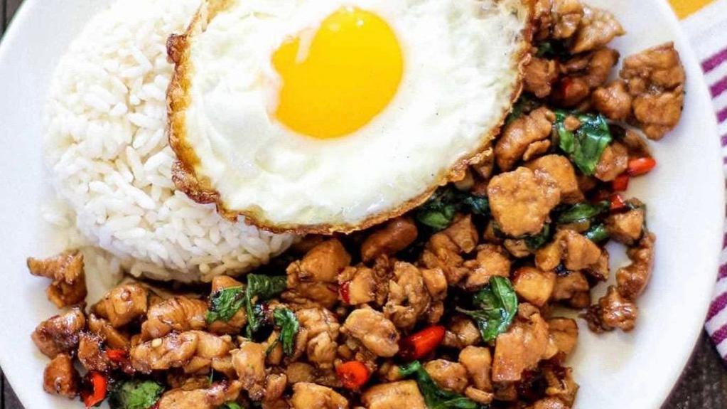 Pad Kra Pow · Ground chicken or pork. thai basil bell pepper onion topped with a fried egg.