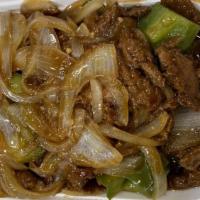 Pepper Steak · Sliced steak stir- fried with green pepper and onions in tasty brown sauce.