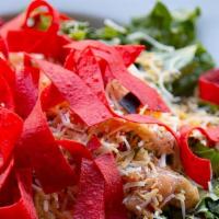 Spicy Cobb Salad · Golden fried chicken tenderloin atop of fresh salad greens. Smoked bacon, avocado slices, ha...