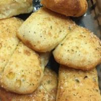 Dolce Bread (12 Pcs) · Soft and chewy breadsticks brushed with our garlic herb butter, grated parmesan, red sauce d...
