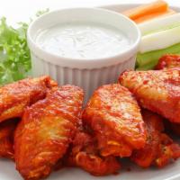 12 Traditional Wings · 12 wings tossed in one sauce of your choice,
  Served with ranch dressing, carrots and celery