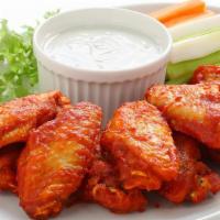 6 Traditional  Wings  · 6 wings tossed in one sauce of your choice.  Served with ranch dressing, carrots and celery.
