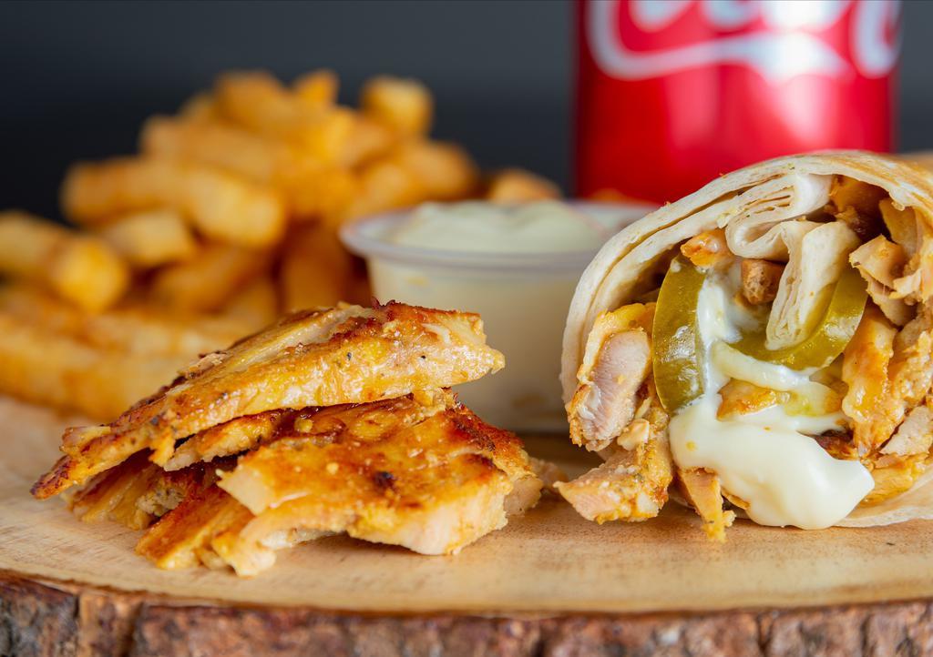 Chicken Shawarma (Combo) · Marinated thin slices of chicken cooked on a rotisserie and served in bread with pickles and our homemade garlic sauce.