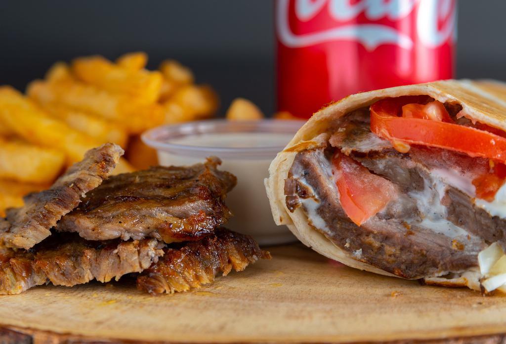 Beef Shawarma (Combo) · Marinated thin slices of beef cooked on a rotisserie and served in bread with tomatoes, onions, and tahini.
