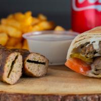 Kefta Kabab (Combo) · Ground and seasoned beef, skewered and grilled with onions, Arabic pickles, tomato, and our ...