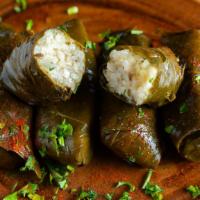 Dawali · Five delightful, Middle Eastern style, stuffed grape leaves filled with our seasoned rice an...