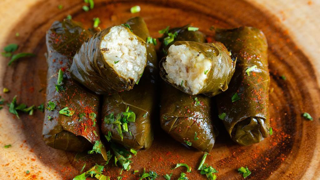 Dawali · Five delightful, Middle Eastern style, stuffed grape leaves filled with our seasoned rice and steamed.