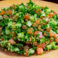 Tabouleh · Freshly diced tomatoes, onions, parsley, cucumber, and cracked wheat with a magic touch of o...