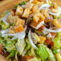 Fattoush · A harmonious mix of romaine lettuce, tomatoes, cucumbers and onions, dressed with our specia...