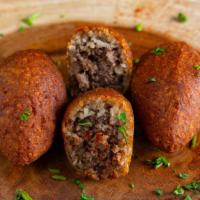 Kibbah · Cracked wheat mixture stuffed with beef and deep fried.