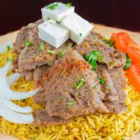 Gyro · Gyro meat cooked on a vertical rotisserie servered with basmati rice or salad or fries. come...