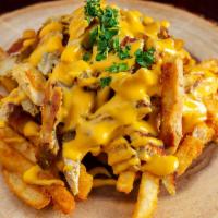 Cheesy Shawarfries · Fries layered with your choice of beef or chicken shawarma topped with melted cheese.