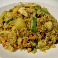 Pineapple Fried Rice · Stir-fried rice with egg, onion, carrots, raisins, and pineapple in our home-made sauce with...