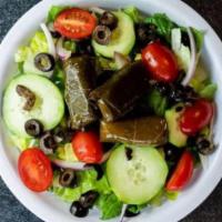 Mediterranean Greek Salad · Romaine lettuce, grape tomato, sweet red onion, cucumbers, black olives, and Greek dolmades....