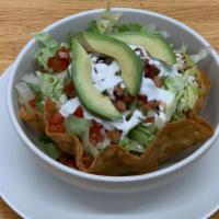 Burrito Bowl · Your Choice of Grilled meat, Served in a crispy tortilla bowl with white rice, black beans, ...