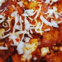 Chilaquiles · Crispy Tortilla chips with your favorite sauce topped with onions, queso fresco, and Crema w...