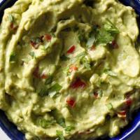Freshly Made Guacamole · Made in-house with fresh Hass avocados,
Onions, cilantro, tomatoes, Lime Juice, a touch of S...