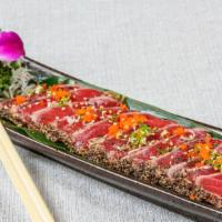 Tuna Tataki (12) · Pepper seared bigeye tuna topped w. masago, scallion, ponzu sauce.