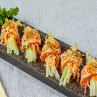 Salmon Honey (5) · Spicy. Spicy krab stick, cucumber, wrapped in seared Atlantic salmon, topped w. masago, scal...