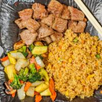 Hibachi Steak · (New York strip) gilled in our special hibachi sauce w. Fried rice or steamed rice and veget...
