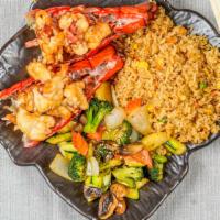  Hibachi Twin Lobster Tail · Gilled in our special hibachi sauce w. fried rice or steamed rice and vegetable. Served w. c...