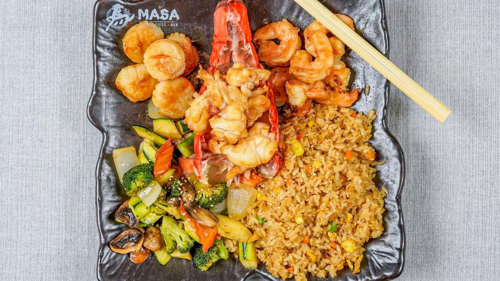 Blue Lava · Shrimp, scallop and lobster tail. Gilled in our special hibachi sauce w. fried rice or steamed rice and vegetable. Served w. clear soup and garden salad.