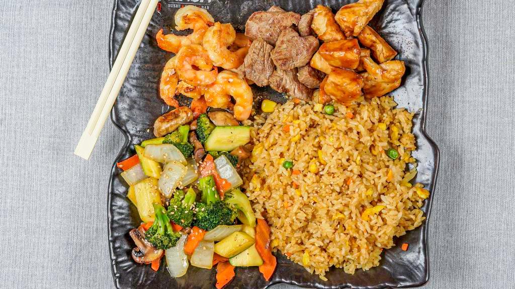 The Impossible · Chicken, steak and shrimp. Gilled in our special hibachi sauce w. fried rice or steamed rice and vegetable. Served w. clear soup and garden salad.