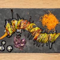 Dragon · Shrimp tempura, cucumber, topped with eel, avocado, unagi sauce, lava sauce.