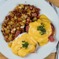 Classic Benedict · Poached eggs and ham over english muffin topped with our housemade hollandaise sauce