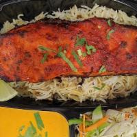 Tandoori Salmon · 8Oz wild caught Salmon fillet marinated in a mildly spiced marinade grilled to perfection se...