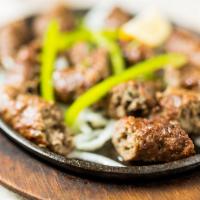 Cuisine Kabab Platter · Chicken tikka, tanri kebab, salmon tikka, tandoori shrimp, lamb seekh kebab, and barra kebab.
