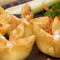 Crab Rangoon (2) · Fried wonton wrapper filled with crab and cream cheese.