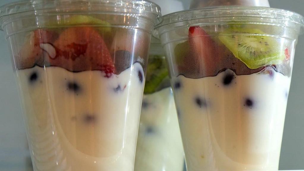 Fruit, Yogurt & Granola Parfaits · Greek Yogurt sweetened to perfection with honey and topped with grapes, kiwi and either blueberries or strawberries (depending on the season.) A granola cup is also included.