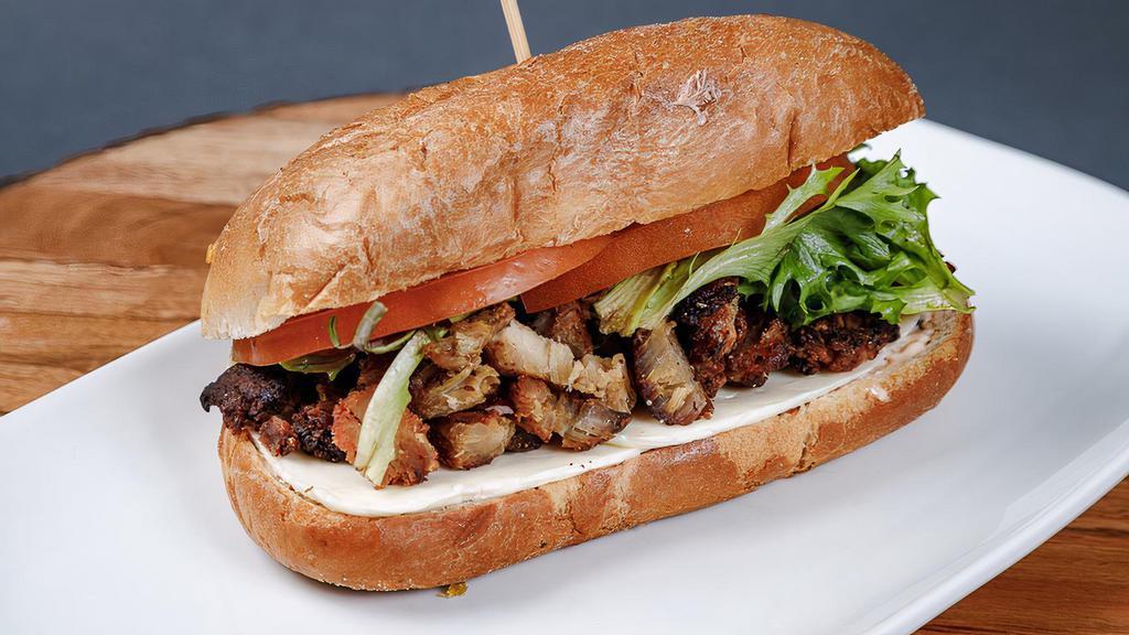 Lechon( Pork) Sandwich  · Our slow roasted pork served on a soft crust style bread; which is pressed to insure a beautiful crunch, with mayonnaise, cheese, lettuce, and tomato. Served with French Fries.