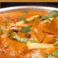 Butter Chicken · Chicken cooked in our tandoor, simmered in creamy onion and tomato sauce with spices.