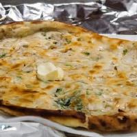 Onion Kulcha · Tandoori baked Naan stuffed with Onions and spices.