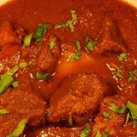 Lamb Kadhai · Boneless Lamb and onion chunks cooked in a special curry sauce.