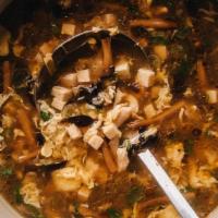 Hot & Sour Soup · Hot & spicy. A blend of chicken, mushrooms, and bamboo shoots cooked with tofu curds in a sp...