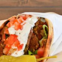 Falafel Pita · Chickpea fritters, romaine lettuce, tomatoes, red onions, tzatziki, and hummus.