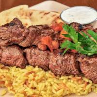 Grilled Steak Souvlaki · Choice steak tenderloin, rice pilaf, french fries or feta fries, side salad, tzatziki, and p...