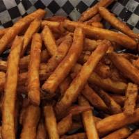 Just Fries · Seasoned potatoes fried golden. Just fries.